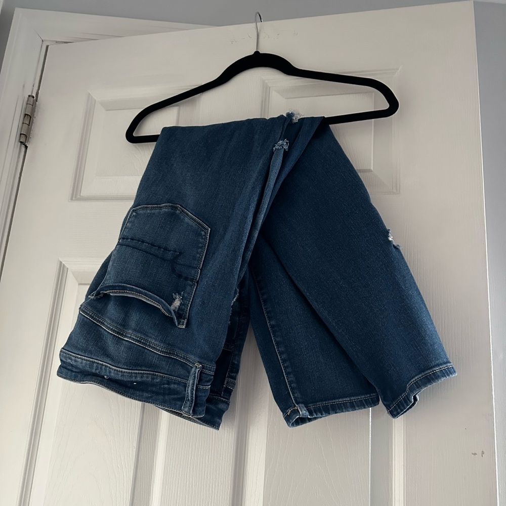 Dark blue ripped jeans